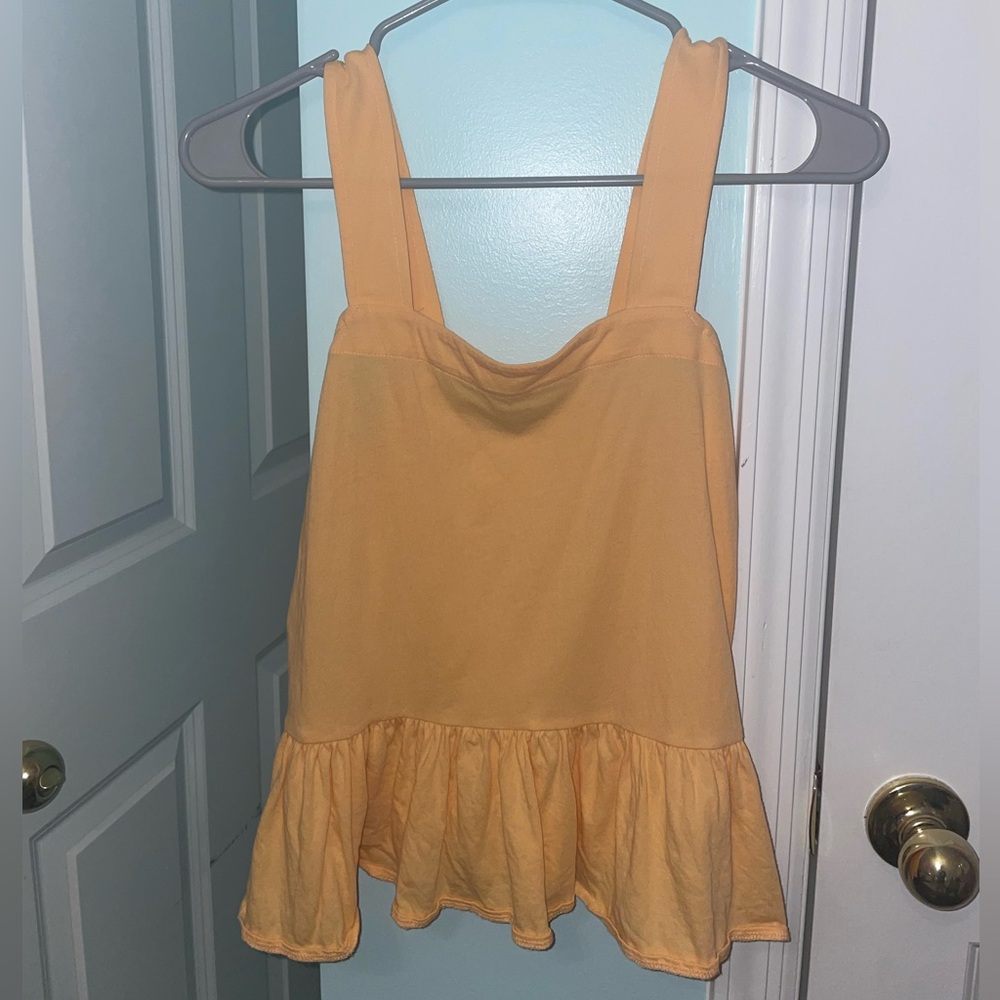 Light orange ruffle tank top